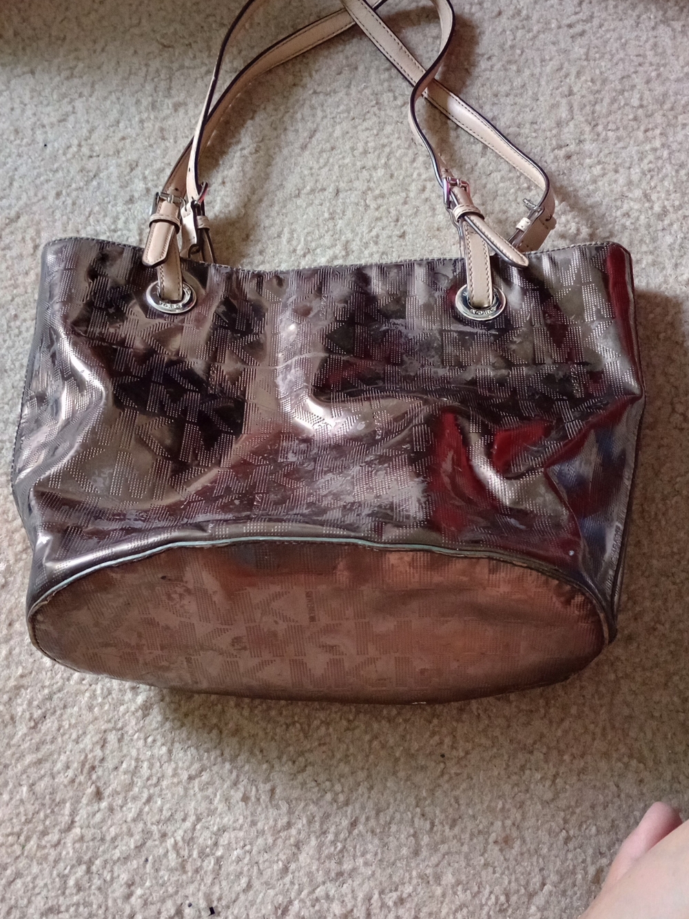 Michael Kors Jet Set East West tote bag in a metallic pewter mirror finish.